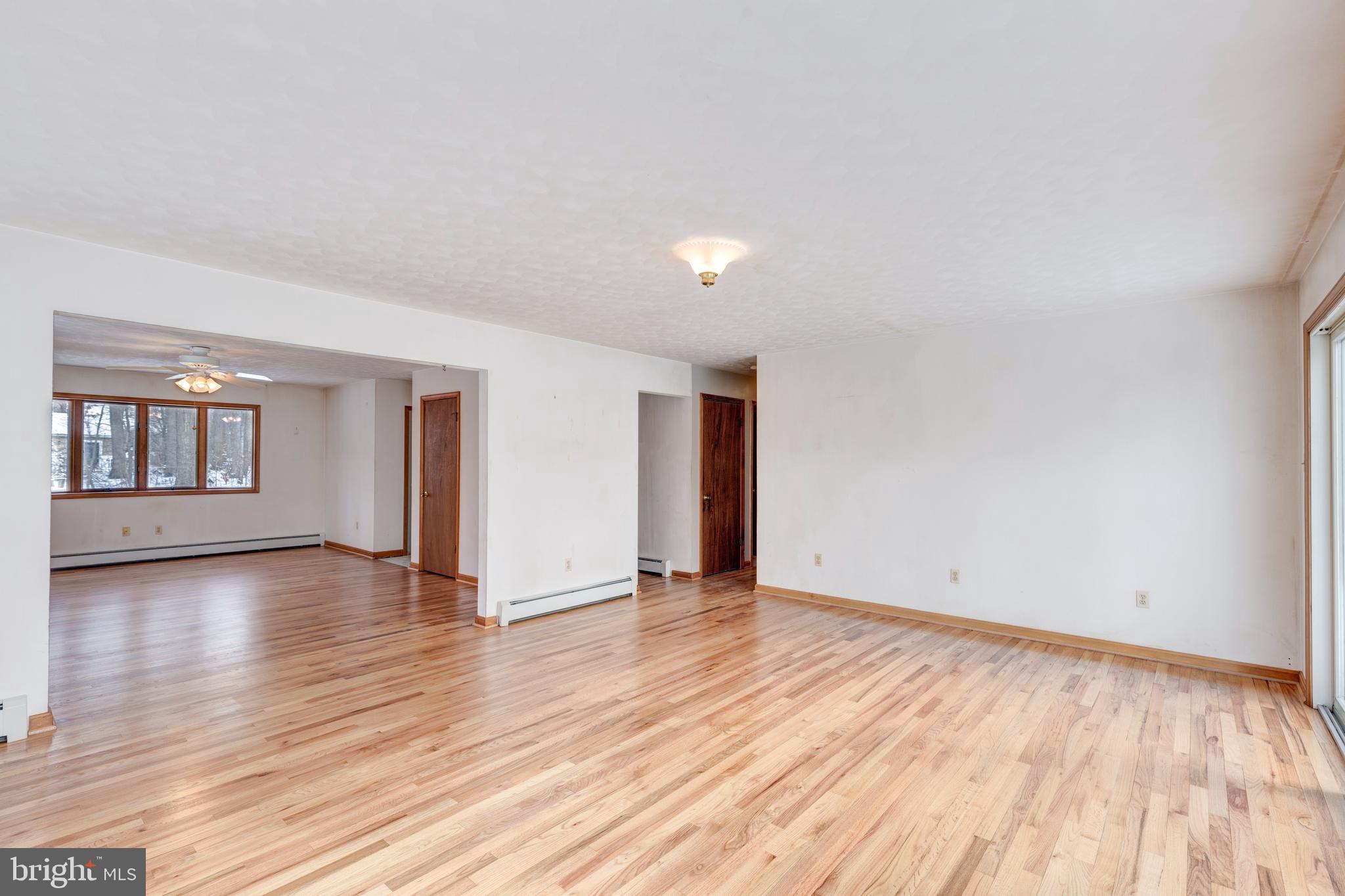 4437 Dave Rill Road Hampstead, MD 21074 - Photo 68 of 68 a view of an empty room with window and wooden floor