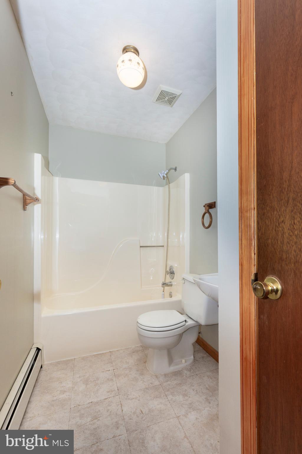 4437 Dave Rill Road Hampstead, MD 21074 - Photo 26 of 68 a bathroom with a toilet a sink and shower