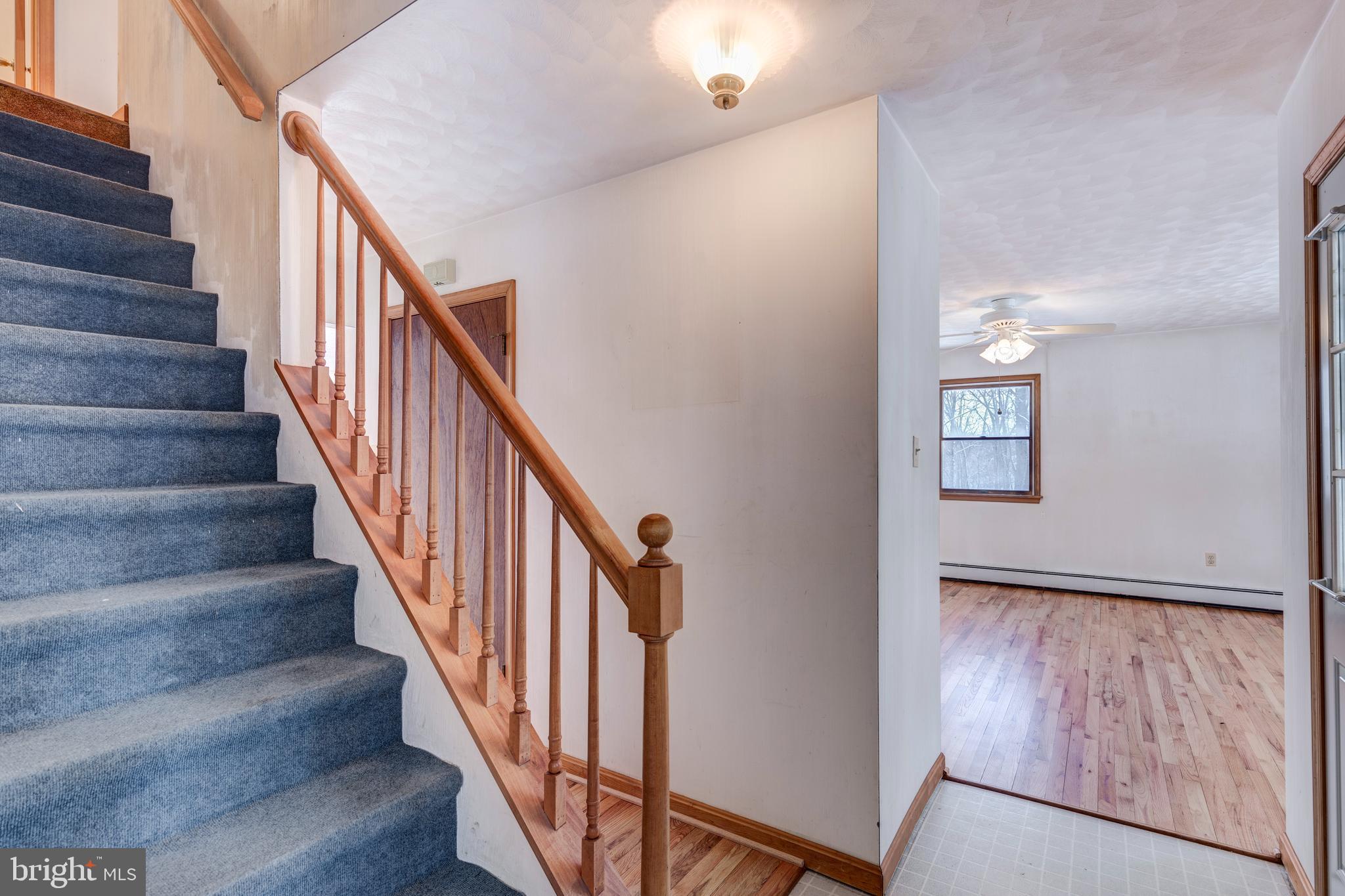 4437 Dave Rill Road Hampstead, MD 21074 - Photo 28 of 68 a view of staircase with wooden floor and staircase