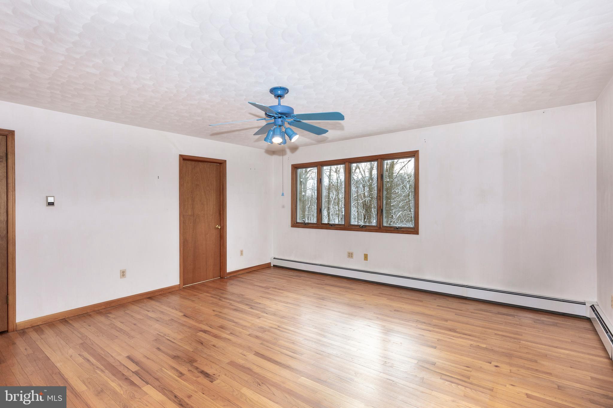 4437 Dave Rill Road Hampstead, MD 21074 - Photo 30 of 68 wooden floor in an empty room with a window