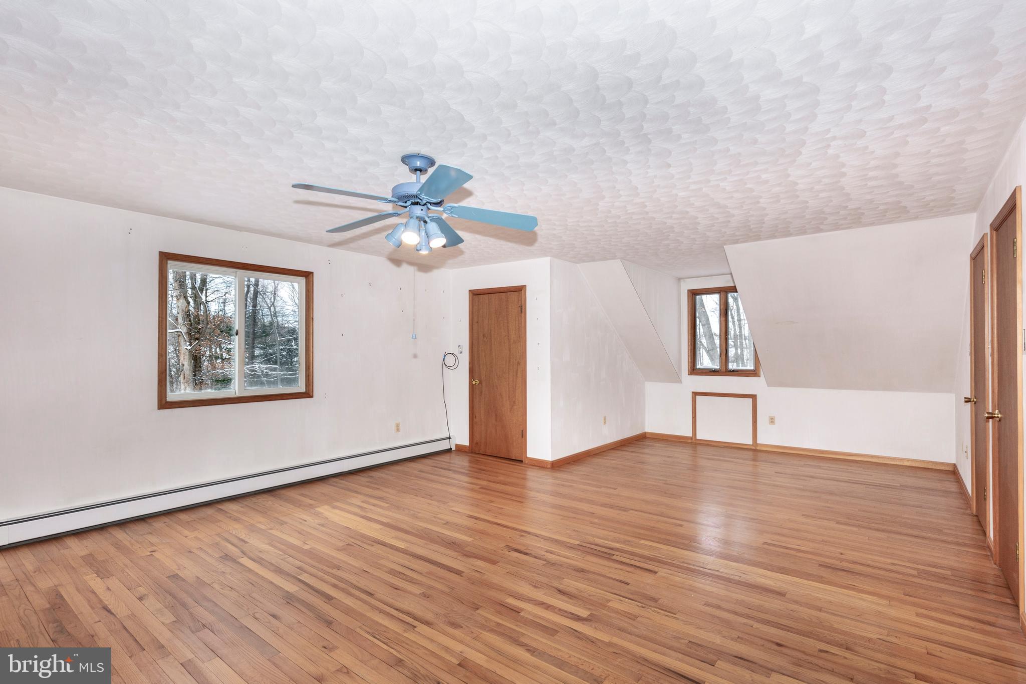4437 Dave Rill Road Hampstead, MD 21074 - Photo 31 of 68 a view of an empty room with window and wooden floor