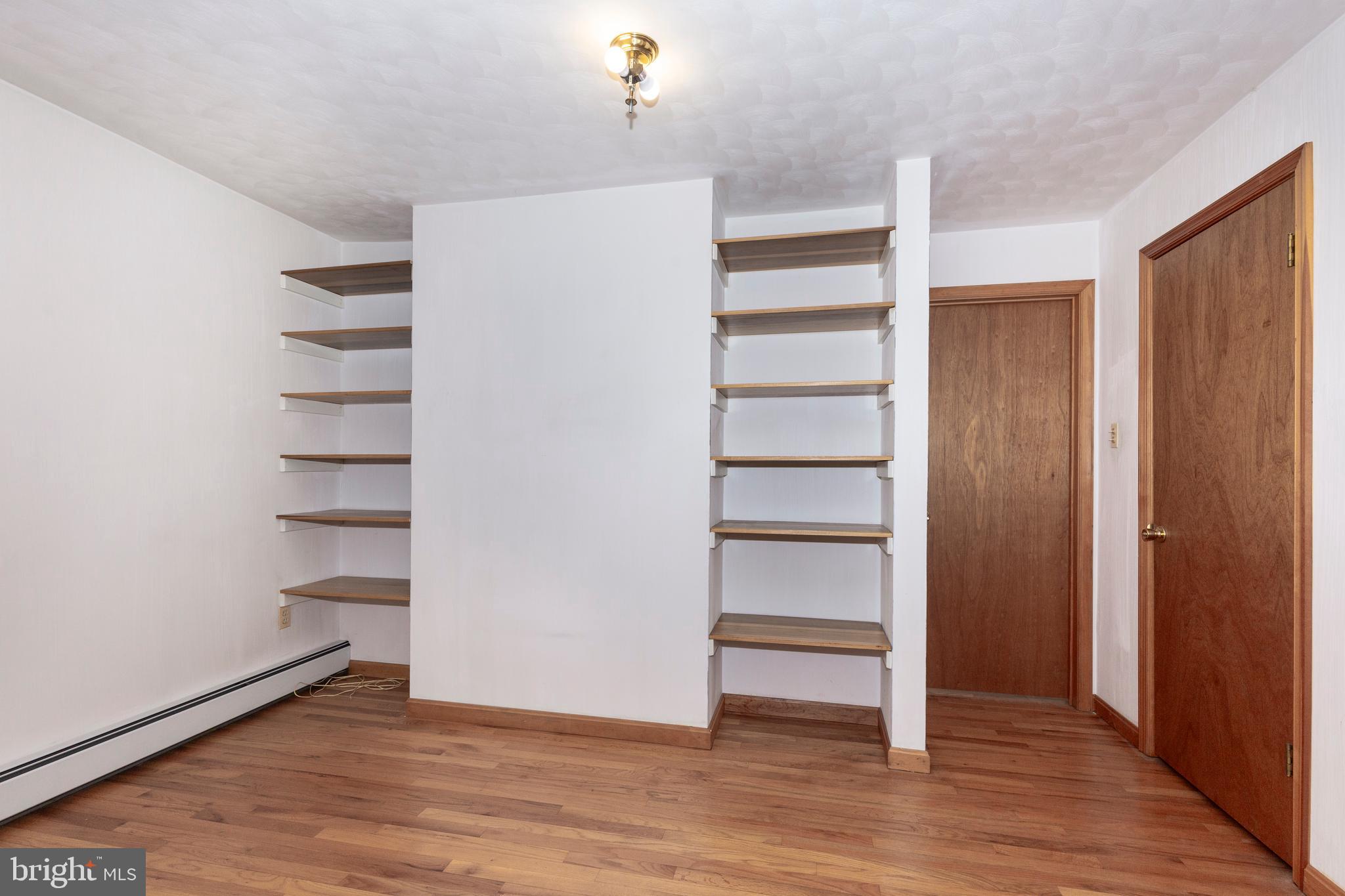 4437 Dave Rill Road Hampstead, MD 21074 - Photo 37 of 68 a view of walk in closet with empty racks