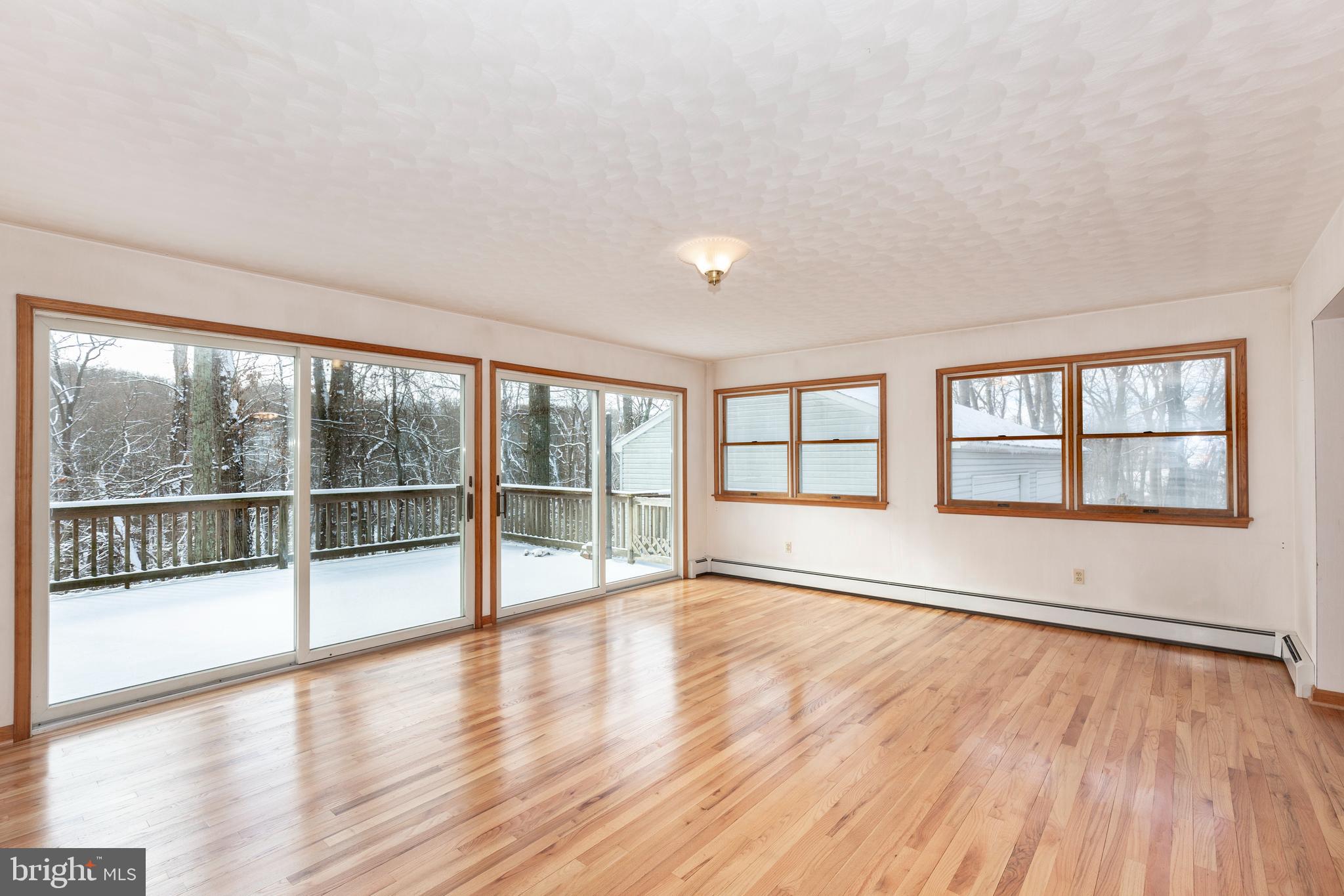 4437 Dave Rill Road Hampstead, MD 21074 - Photo 4 of 68 wooden floor in an empty room with a window