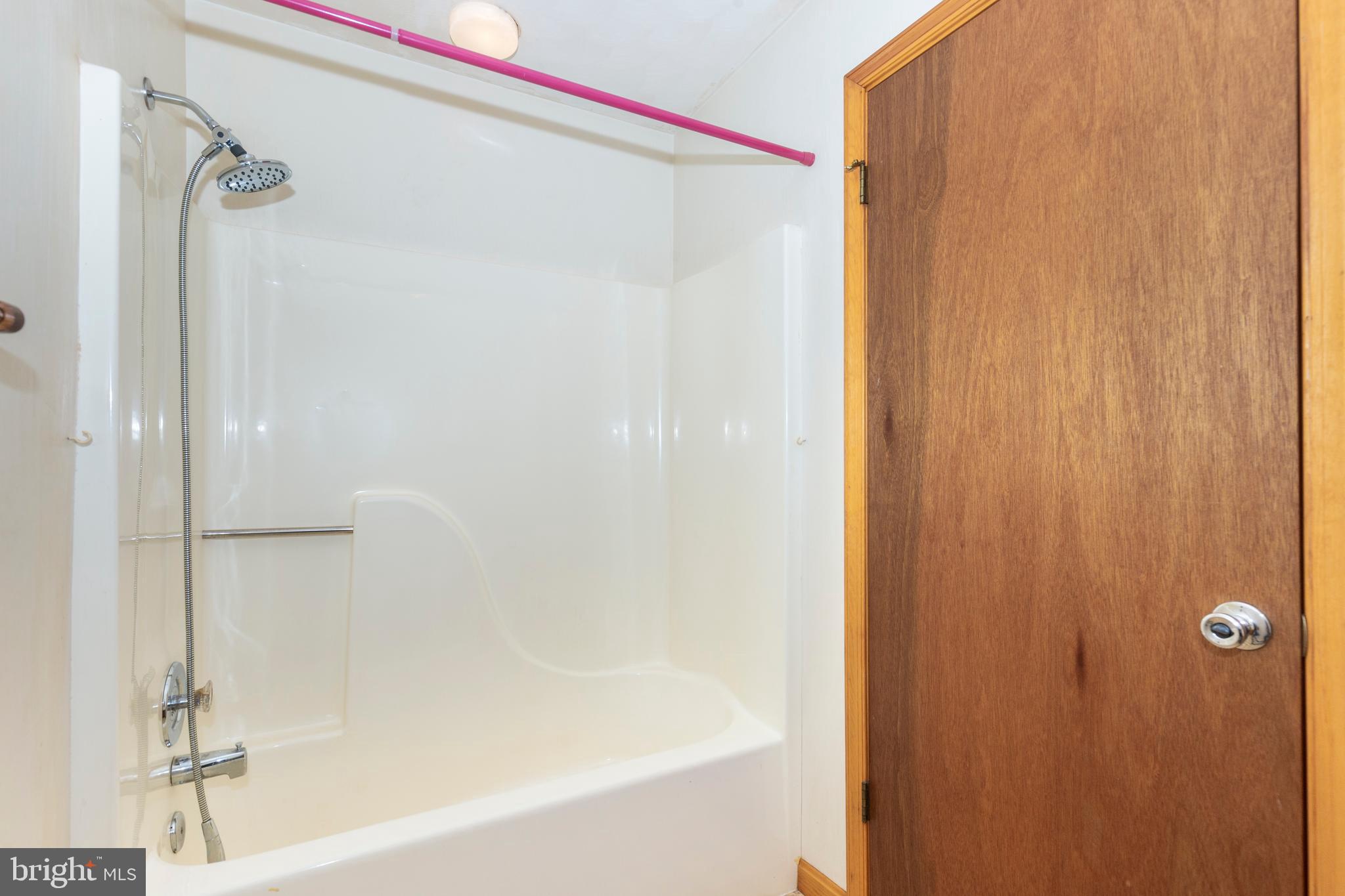4437 Dave Rill Road Hampstead, MD 21074 - Photo 43 of 68 a bathroom with a bathtub and a shower