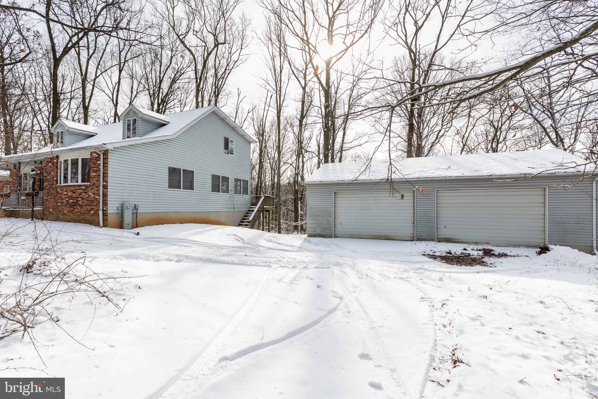 4437 Dave Rill Road Hampstead, MD 21074 - Photo 51 of 68 a view of white house with a yard covered in snow