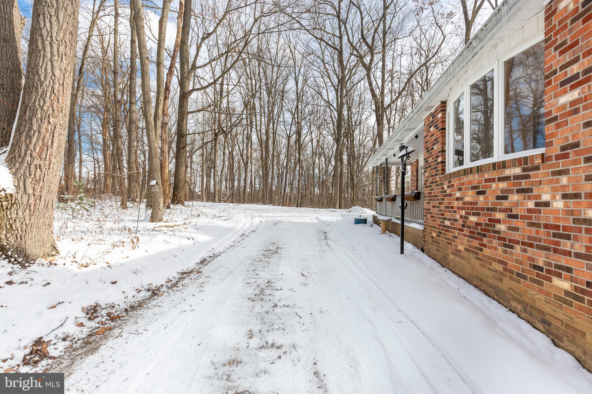 4437 Dave Rill Road Hampstead, MD 21074 - Photo 58 of 68 a view of a yard with snow on the road