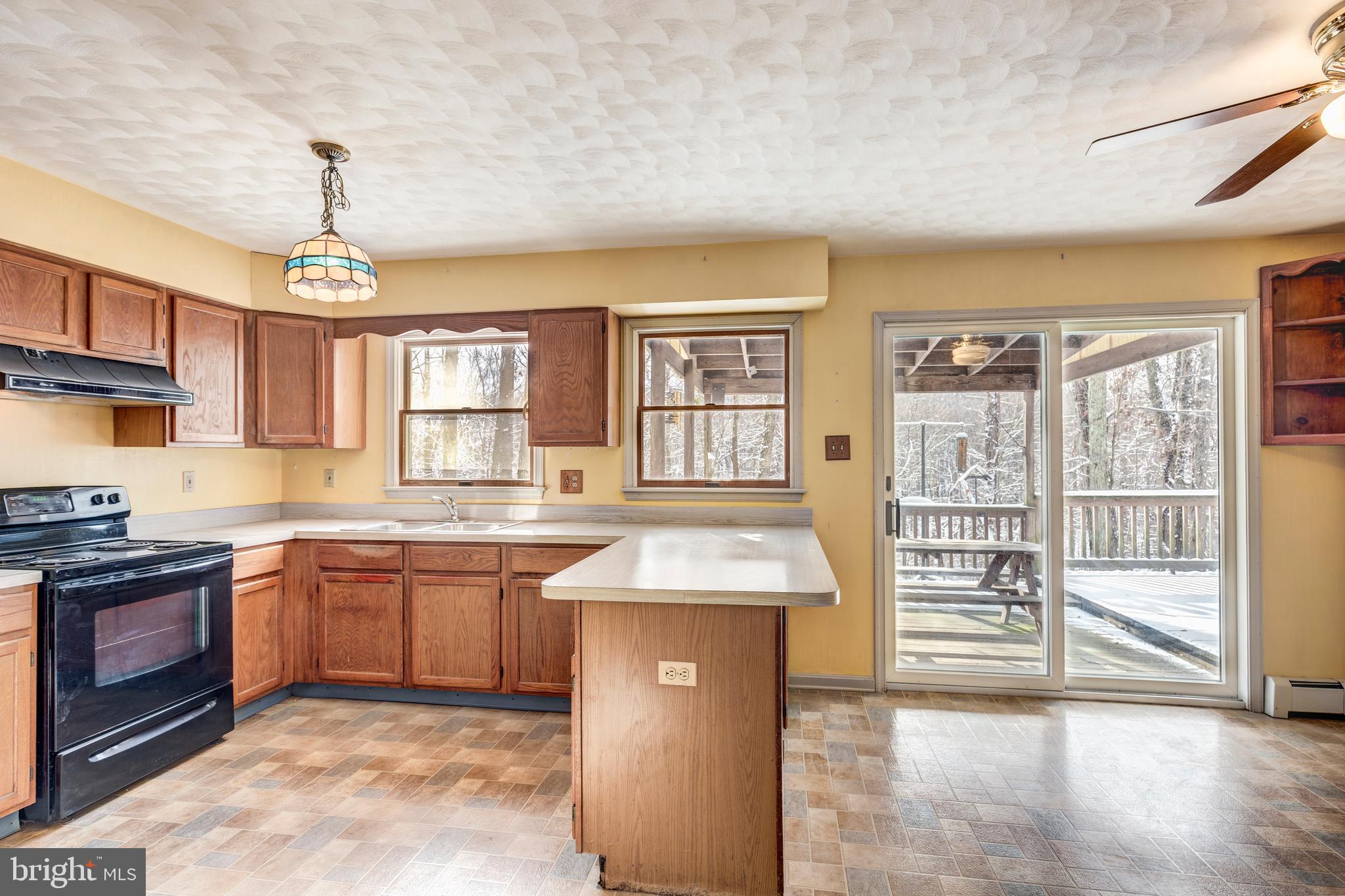 4437 Dave Rill Road Hampstead, MD 21074 - Photo 6 of 68 a kitchen with stainless steel appliances granite countertop a stove sink and cabinets