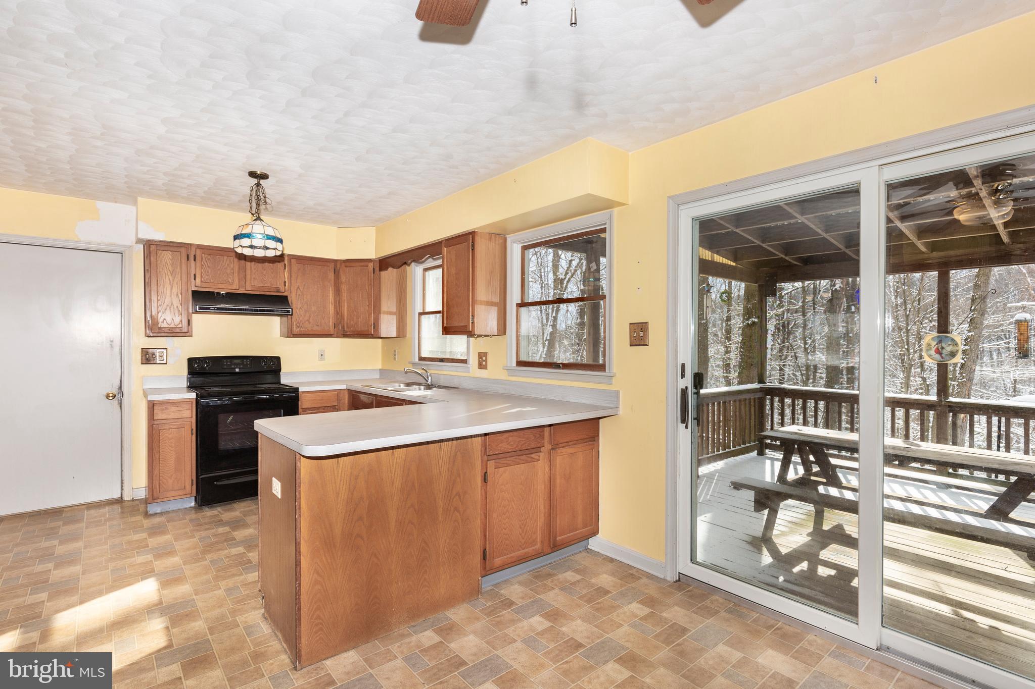 4437 Dave Rill Road Hampstead, MD 21074 - Photo 10 of 68 a kitchen with stainless steel appliances granite countertop a stove and a refrigerator