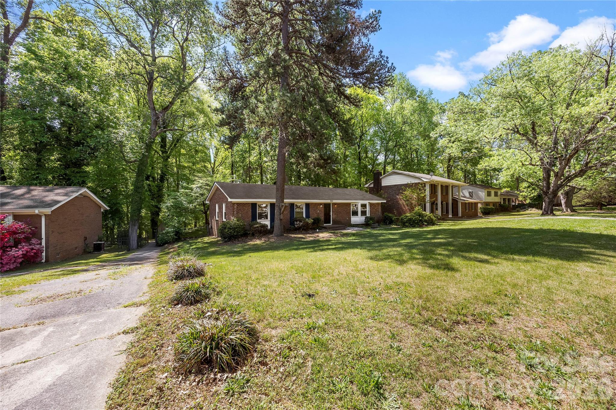 7001 Crossridge Road Charlotte, NC 28214 - Photo 12 of 30 a view of a house with yard and large trees