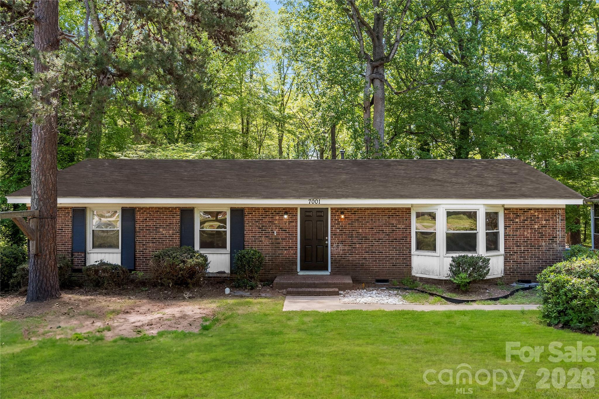 7001 Crossridge Road Charlotte, NC 28214 - Photo 30 of 30 front view of a house with a yard