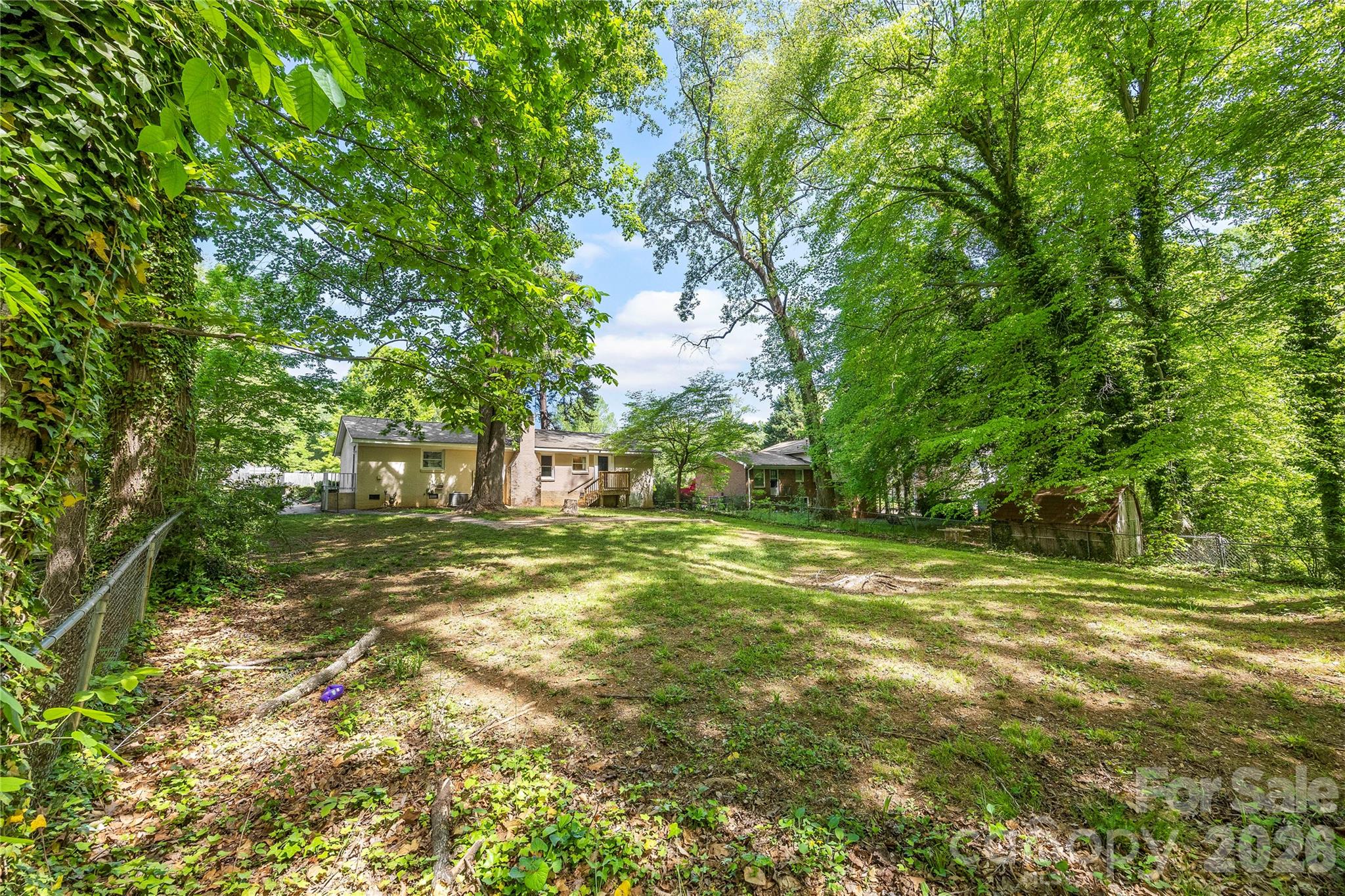 7001 Crossridge Road Charlotte, NC 28214 - Photo 10 of 30 a view of a trees with a yard