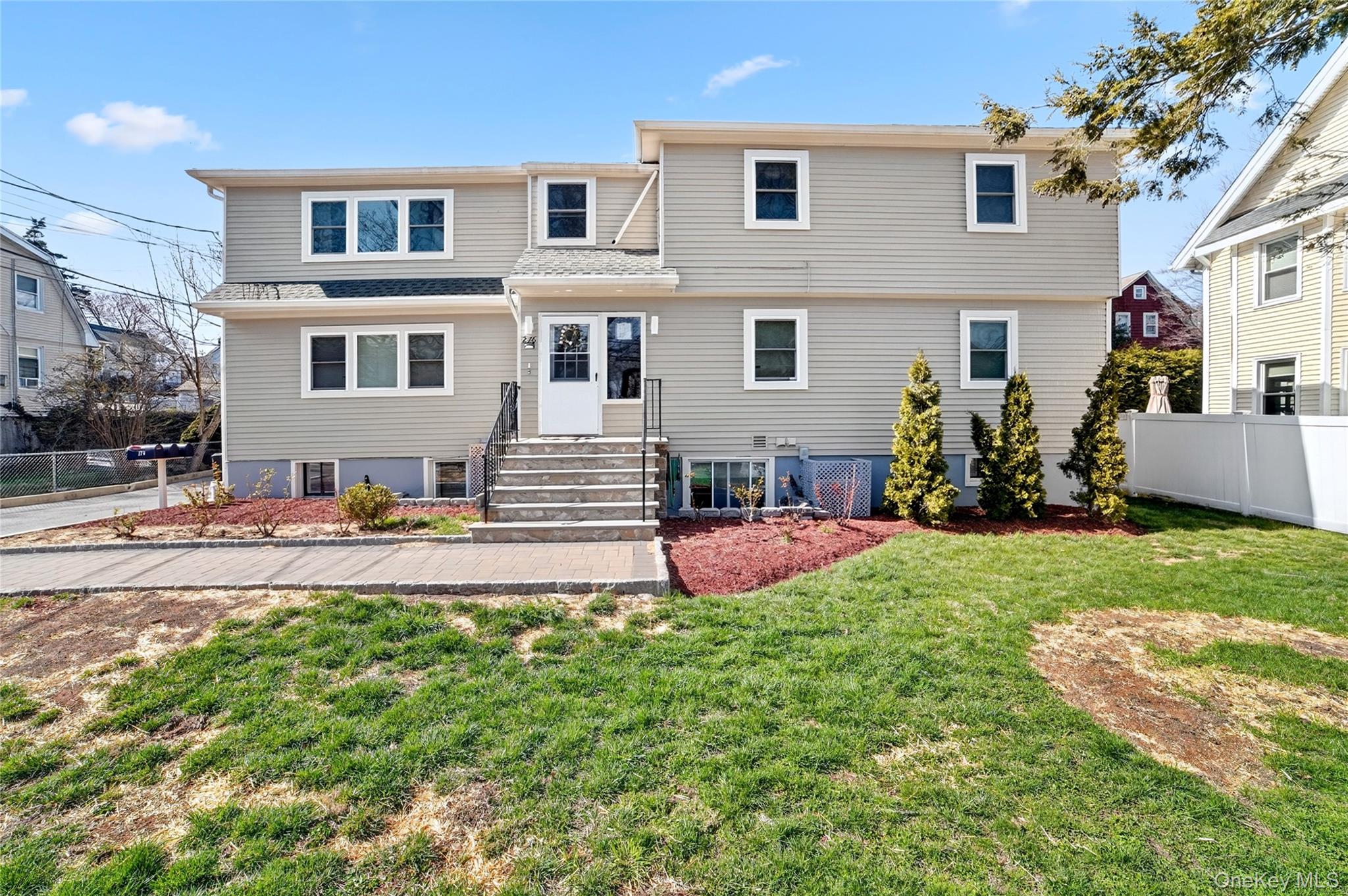 276 5th Avenue New Rochelle, NY 10801 - Photo 1 of 40 a front view of house with yard and outdoor seating