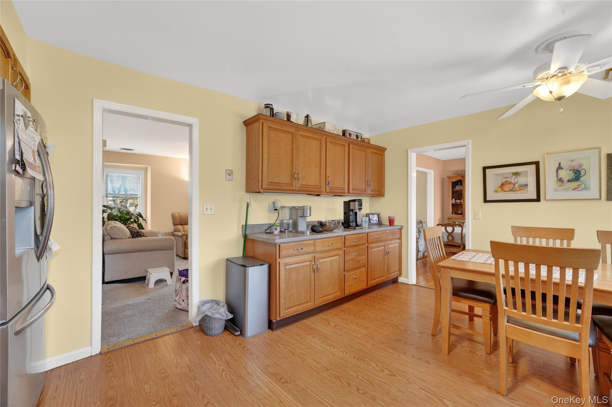 276 5th Avenue New Rochelle, NY 10801 - Photo 15 of 40 a kitchen with a refrigerator and a view of living room