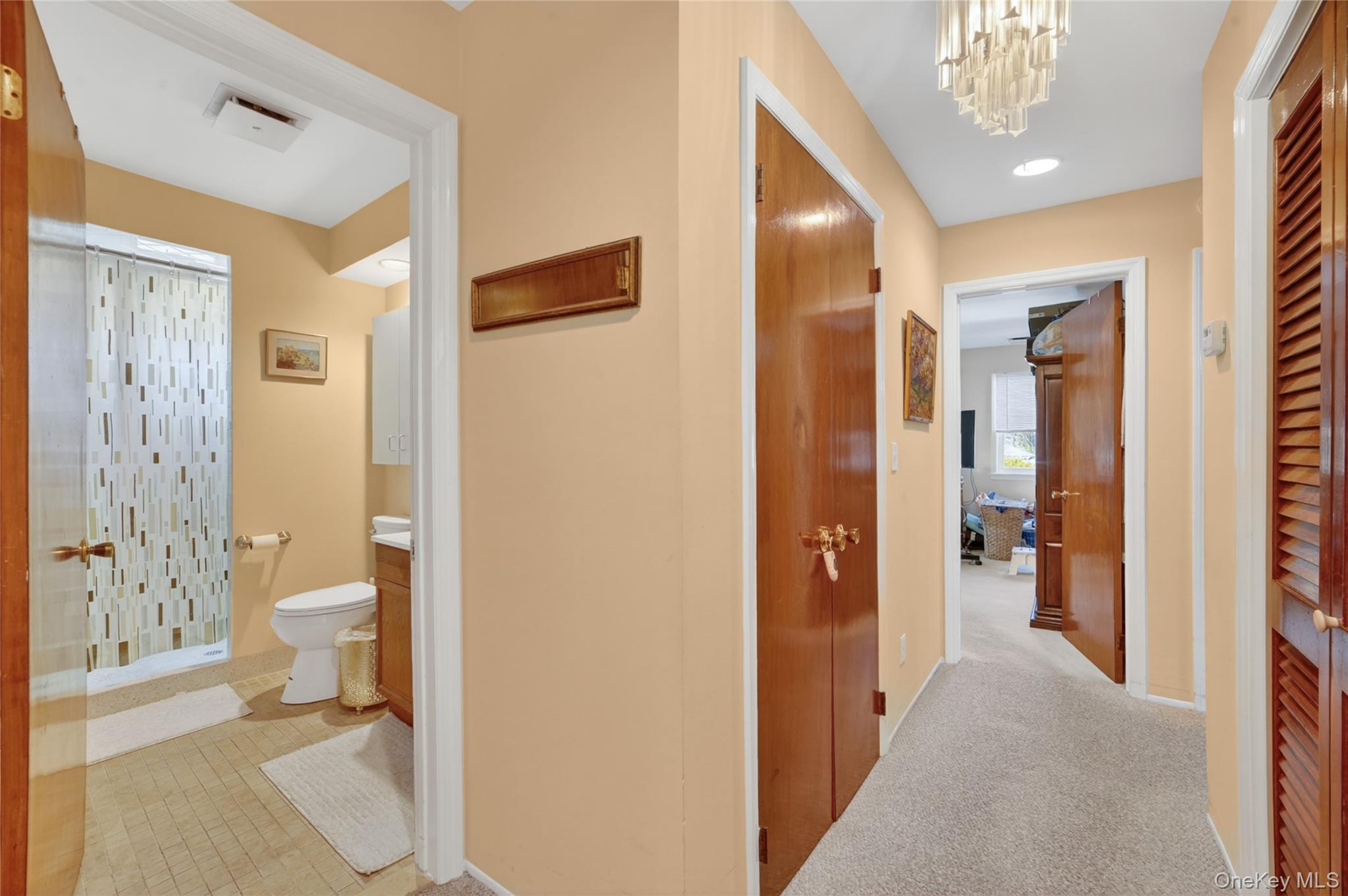 276 5th Avenue New Rochelle, NY 10801 - Photo 17 of 40 a bathroom with a granite countertop shower a toilet and a sink