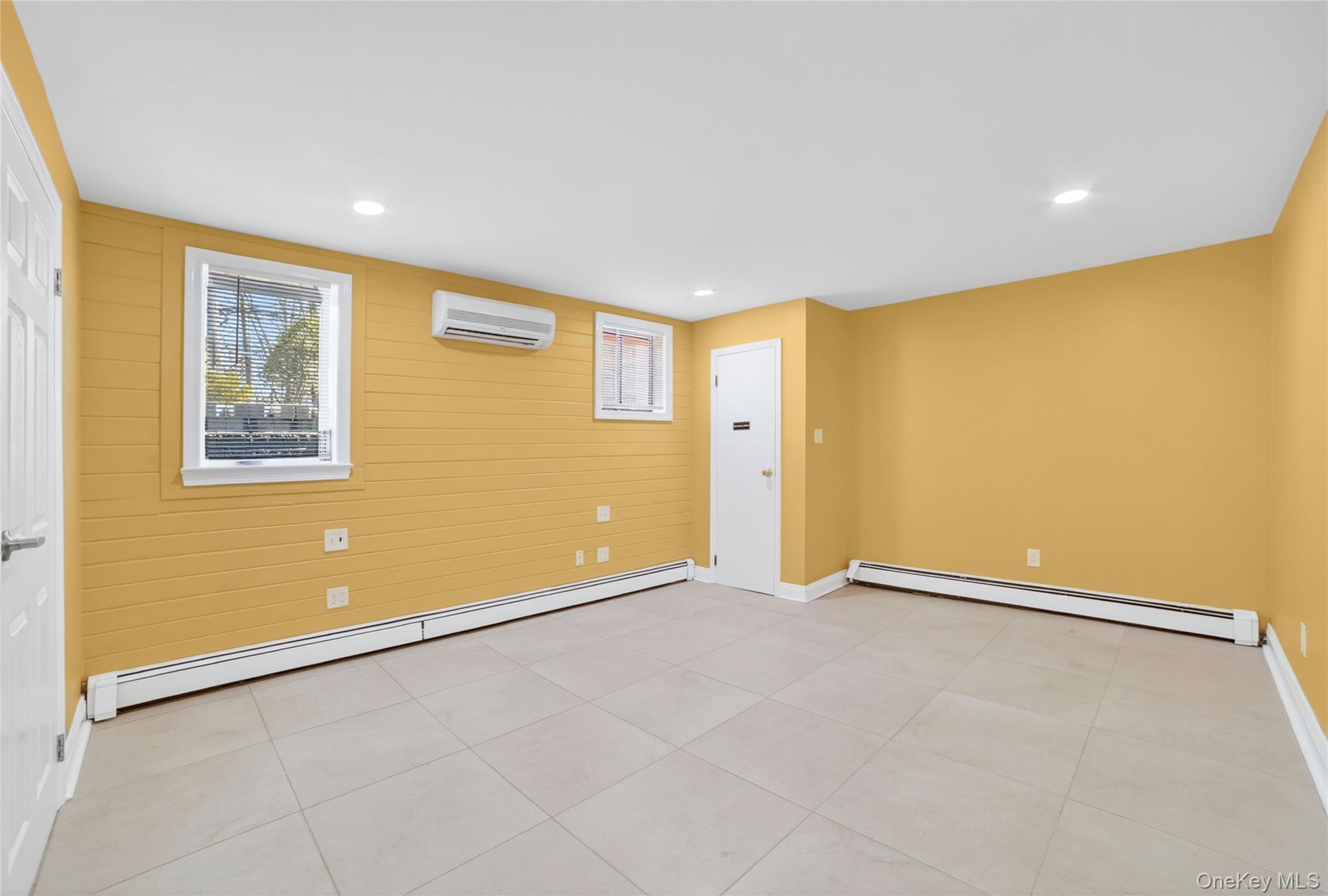 276 5th Avenue New Rochelle, NY 10801 - Photo 28 of 40 an empty room with a empty space and windows