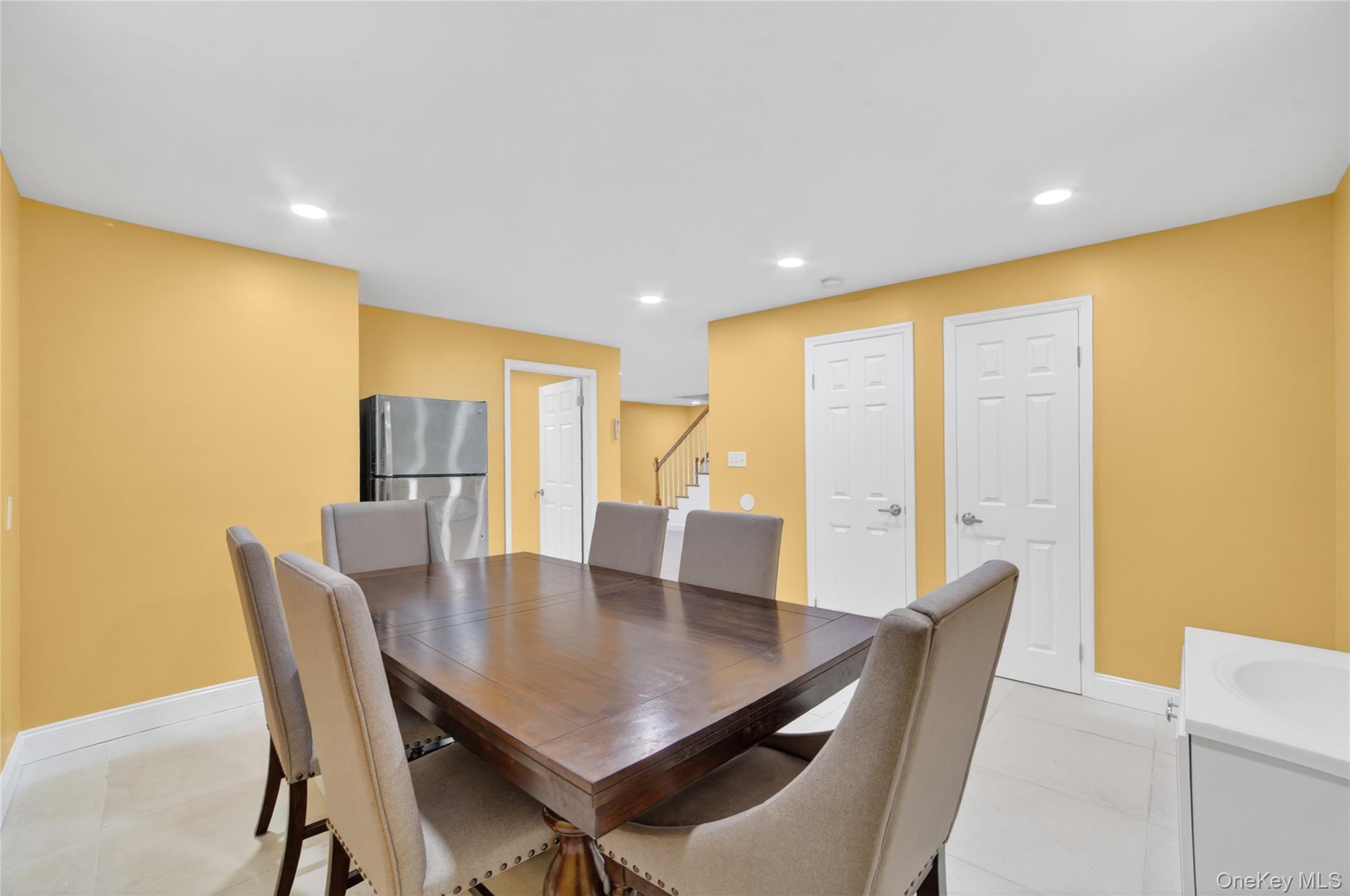276 5th Avenue New Rochelle, NY 10801 - Photo 34 of 40 a view of a dining room with furniture and wooden floor