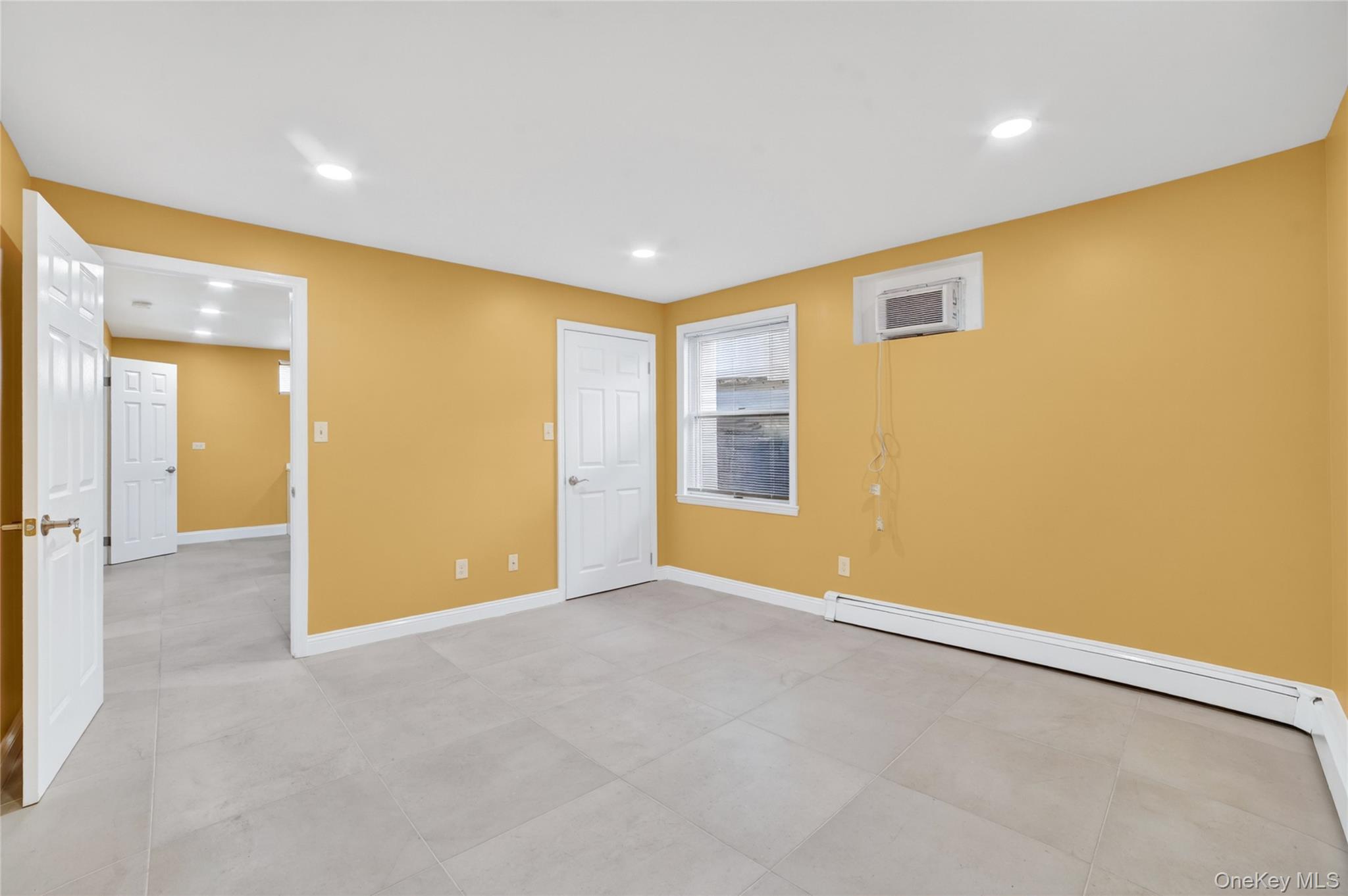 276 5th Avenue New Rochelle, NY 10801 - Photo 36 of 40 an empty room with a empty space and windows