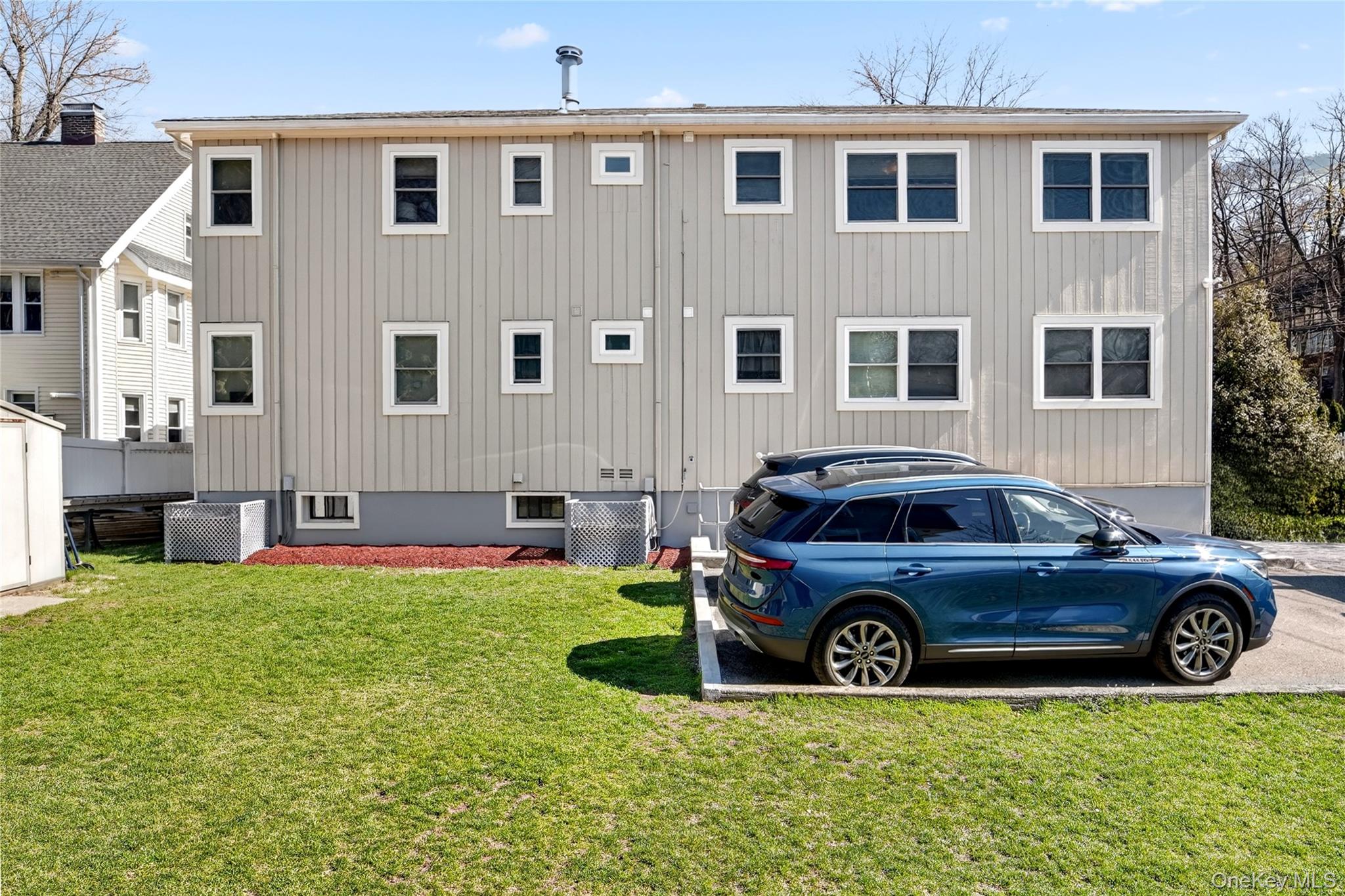 276 5th Avenue New Rochelle, NY 10801 - Photo 40 of 40 a view of a car parked in front of a big house