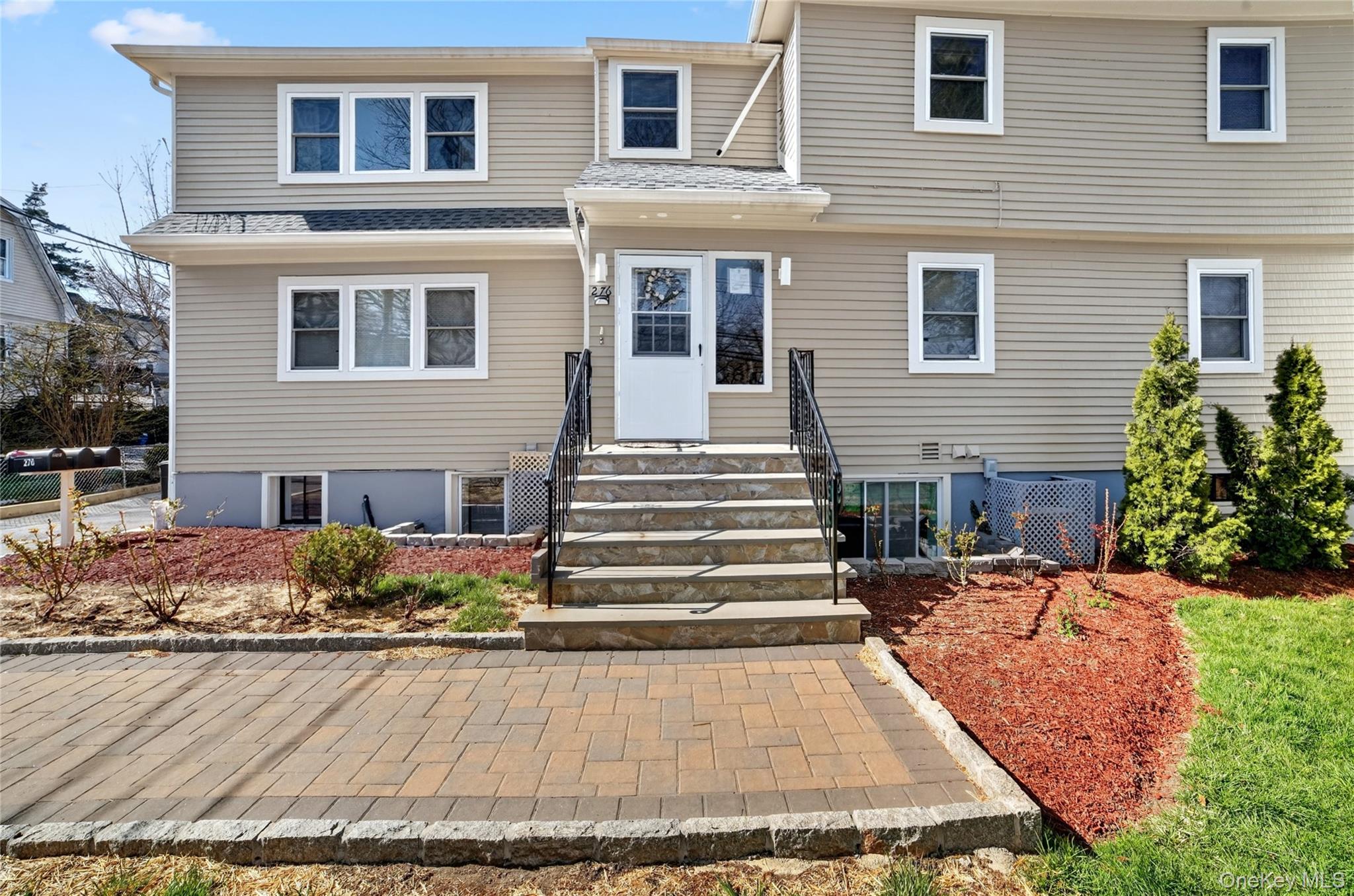 276 5th Avenue New Rochelle, NY 10801 - Photo 4 of 40 a front view of a house with entertaining space