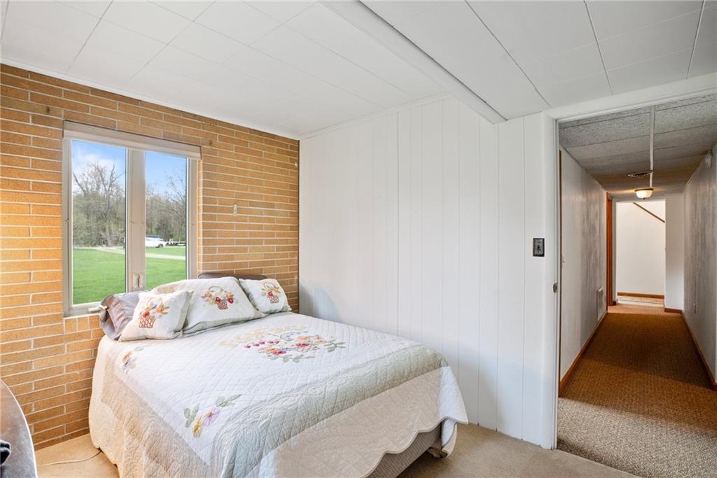 1184 River Road Freeport, PA 16229 - Photo 16 of 25 a bedroom with a bed and a walk in closet
