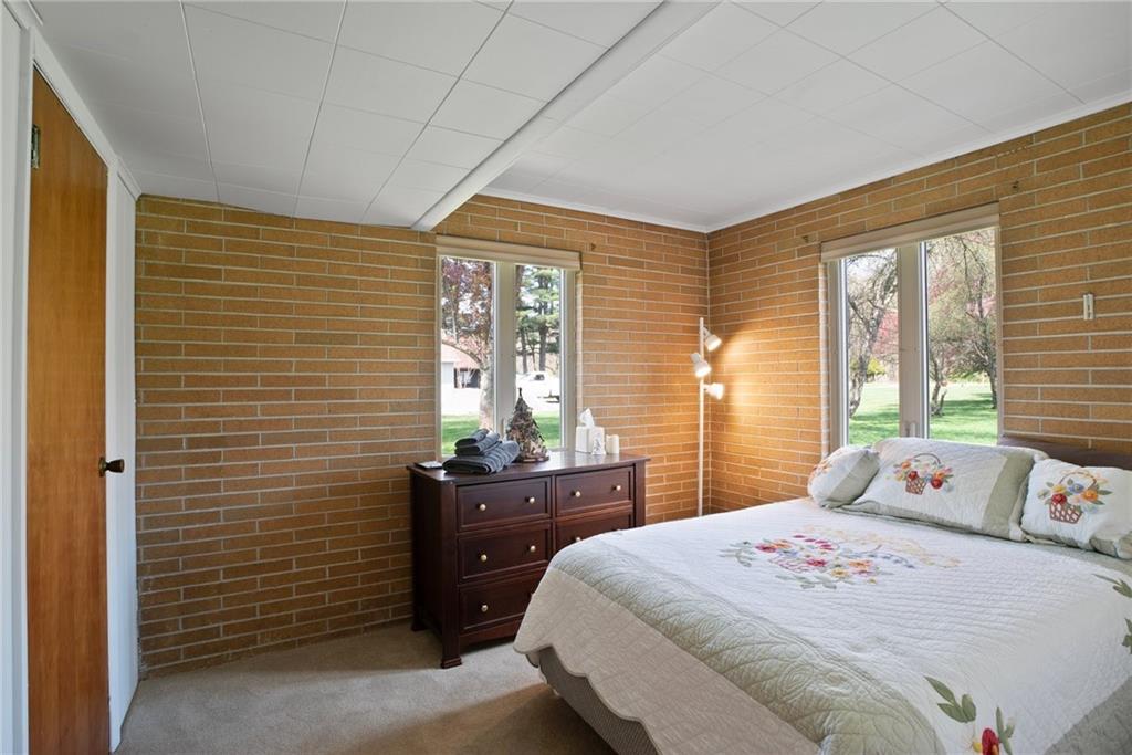 1184 River Road Freeport, PA 16229 - Photo 17 of 25 a bedroom with a bed and large windows