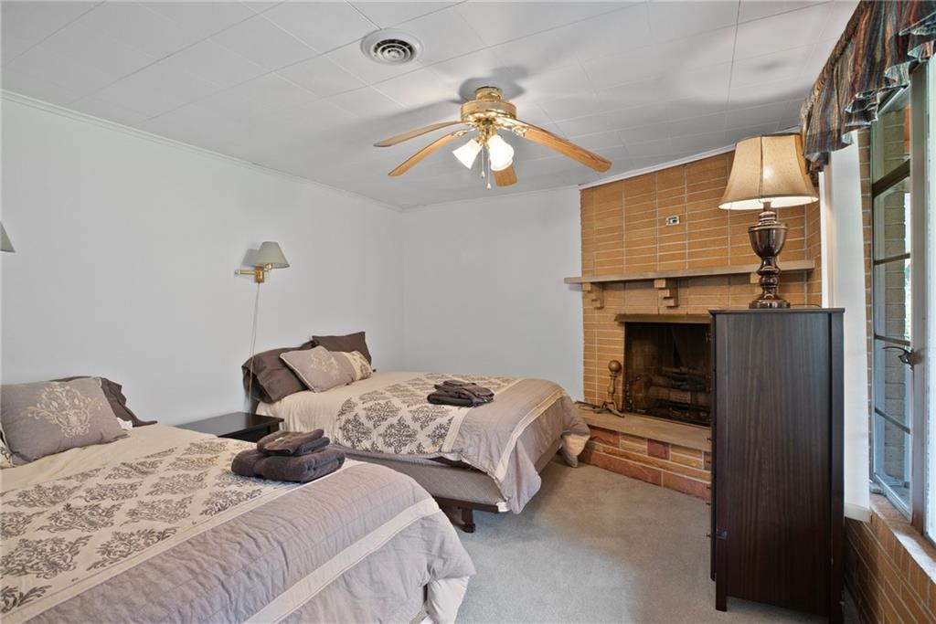 1184 River Road Freeport, PA 16229 - Photo 18 of 25 a bedroom with a bed and a chandelier