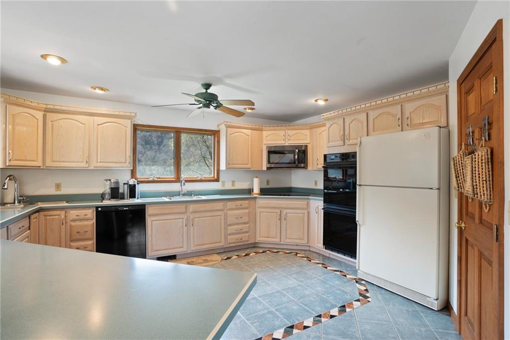 1184 River Road Freeport, PA 16229 - Photo 9 of 25 a kitchen with a refrigerator and a sink