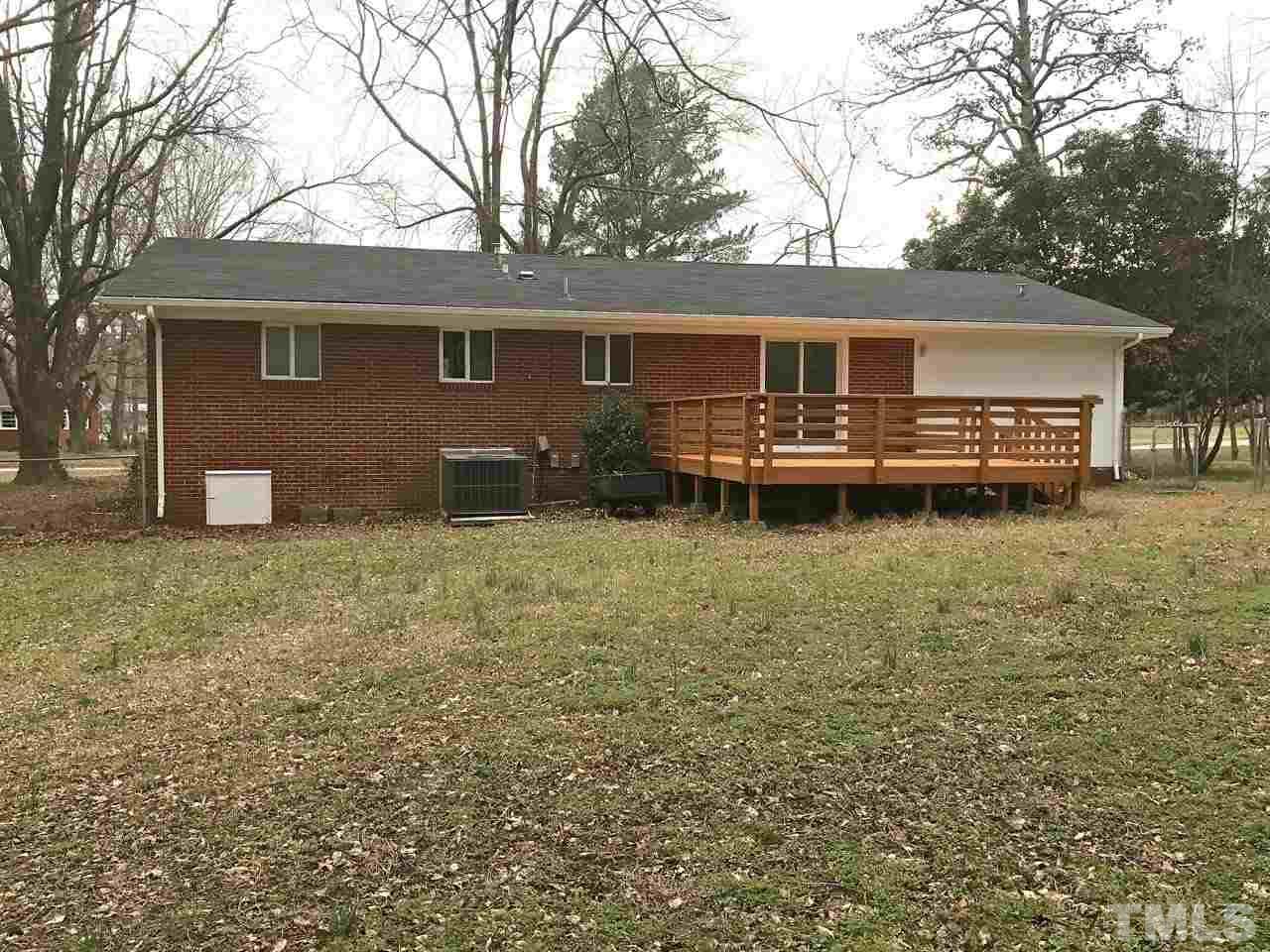 111 Barclay Road Durham, NC 27712 - Photo 2 of 21 a backyard of a house with table and chairs