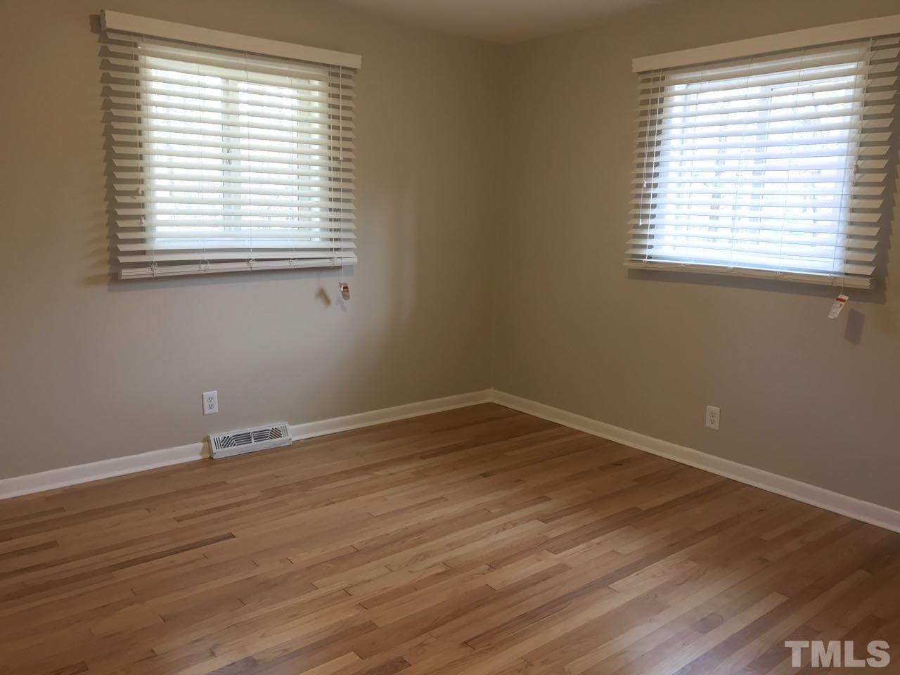 111 Barclay Road Durham, NC 27712 - Photo 12 of 21 an empty room with wooden floor and a window
