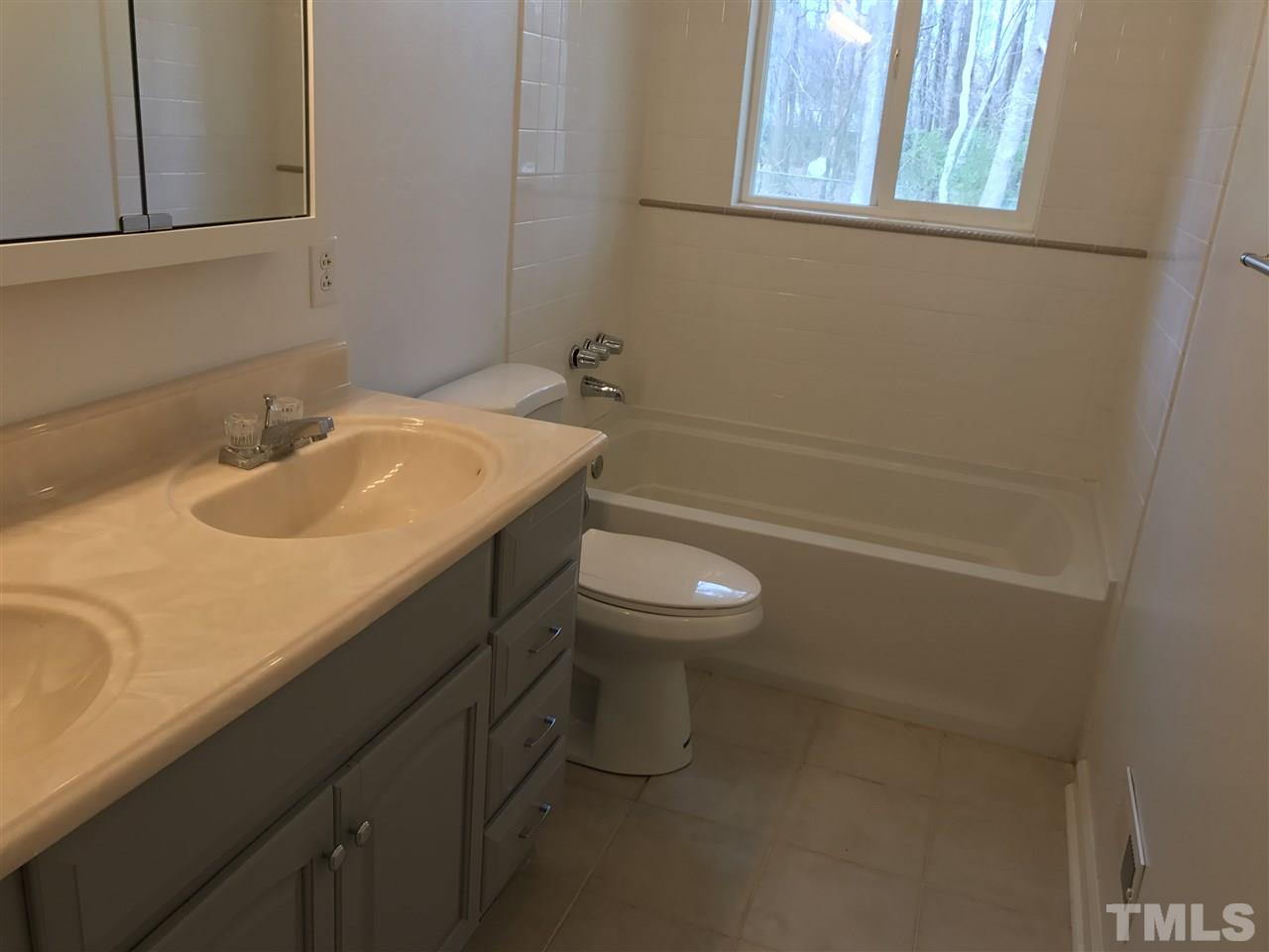 111 Barclay Road Durham, NC 27712 - Photo 14 of 21 a bathroom with a sink toilet and shower