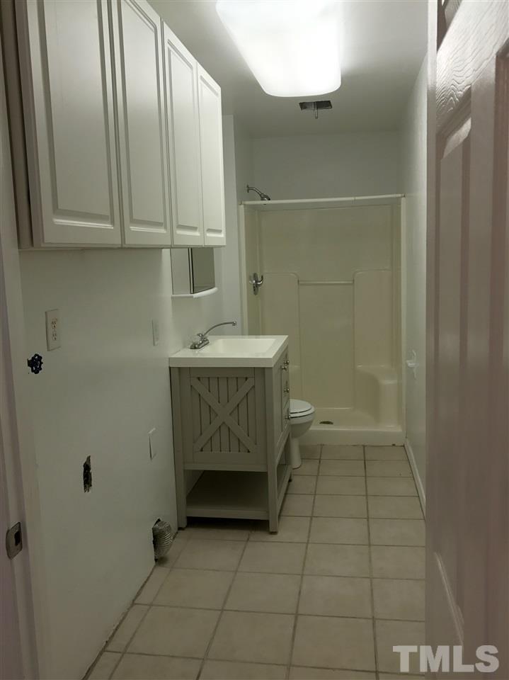 111 Barclay Road Durham, NC 27712 - Photo 7 of 21 a bathroom with a sink a toilet and shower