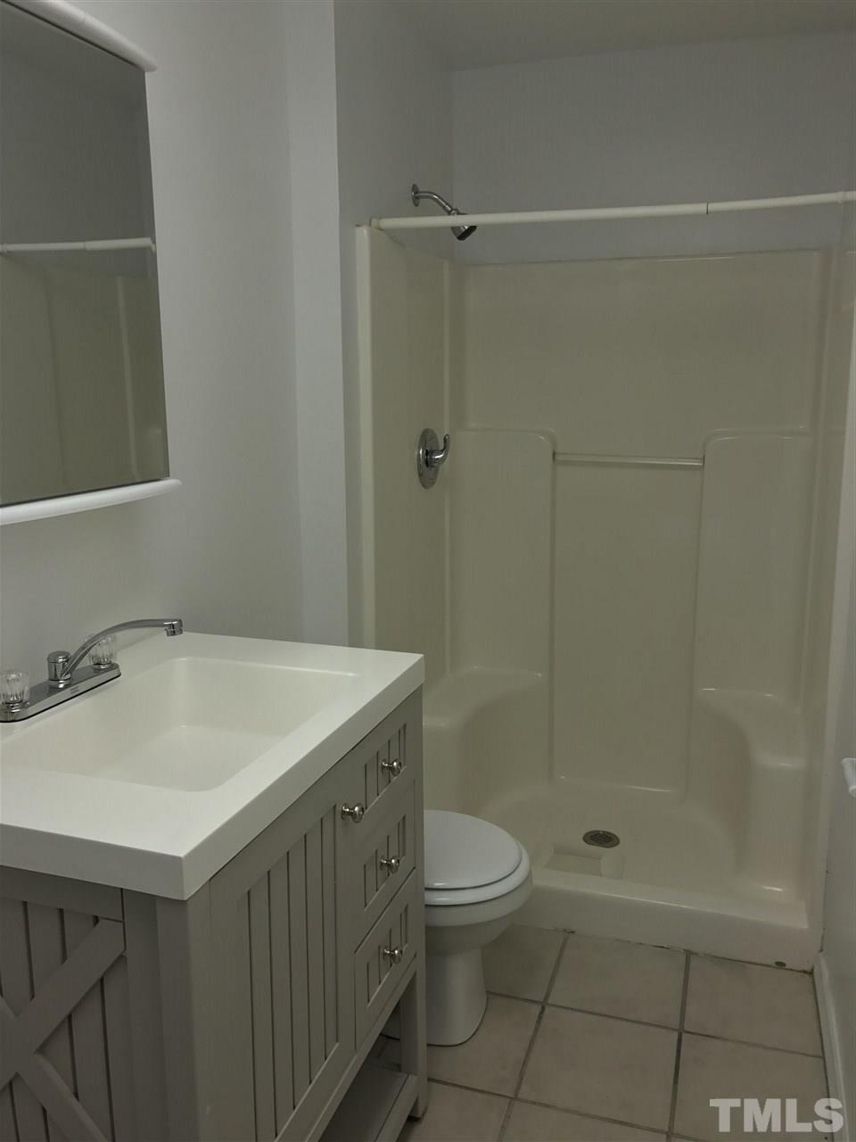 111 Barclay Road Durham, NC 27712 - Photo 8 of 21 a bathroom with a sink a toilet and shower