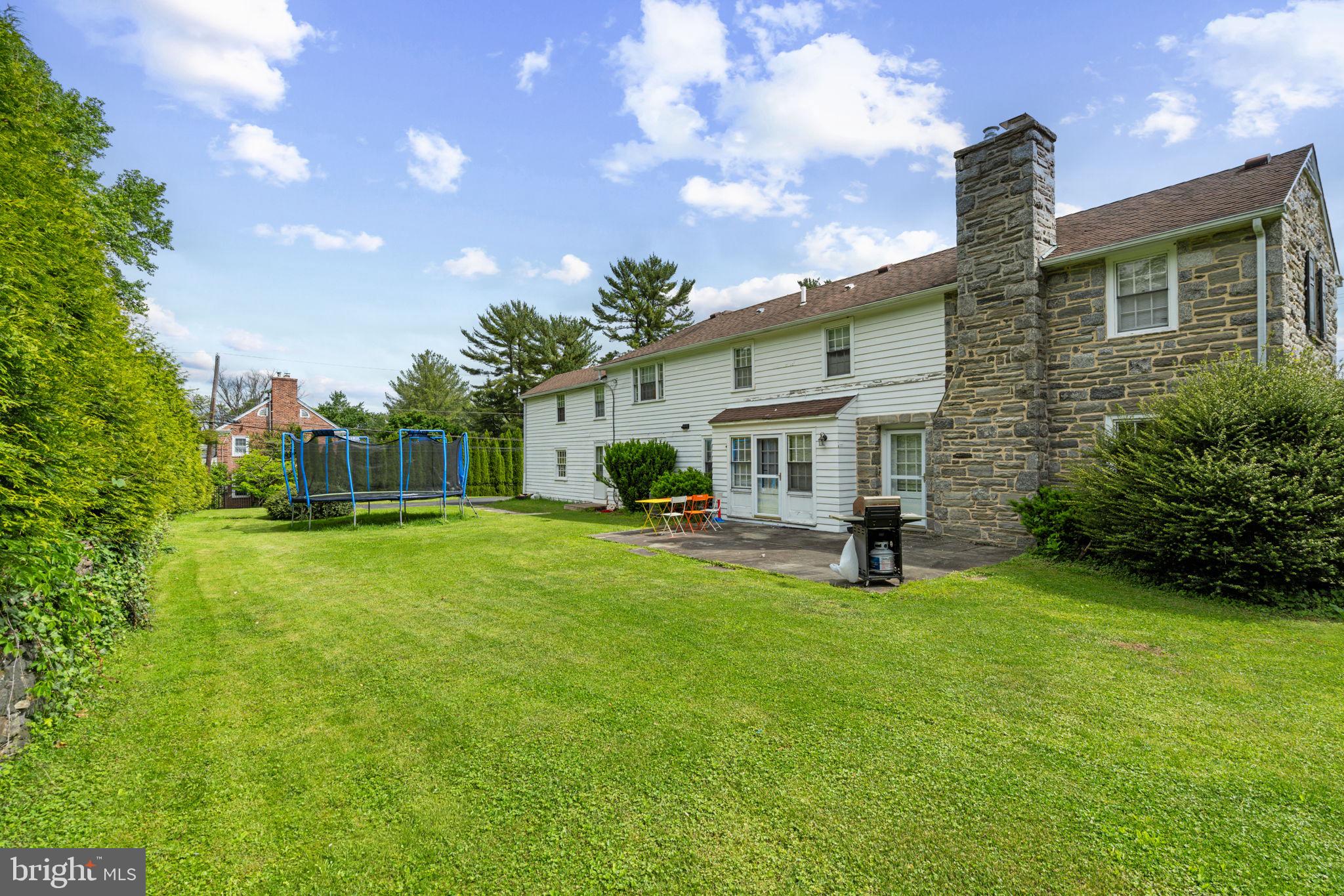504 Conshohocken State Road Gladwyne, PA 19035 - Photo 11 of 19 a front view of a house with garden and porch