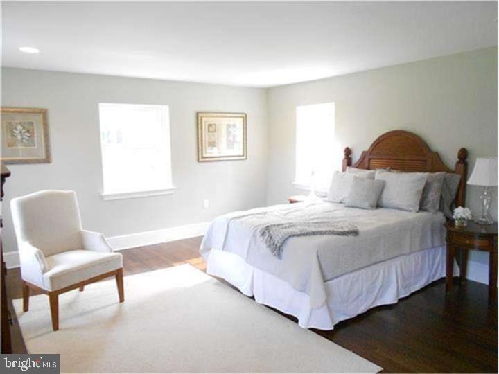 504 Conshohocken State Road Gladwyne, PA 19035 - Photo 15 of 19 a bedroom with a bed and chair