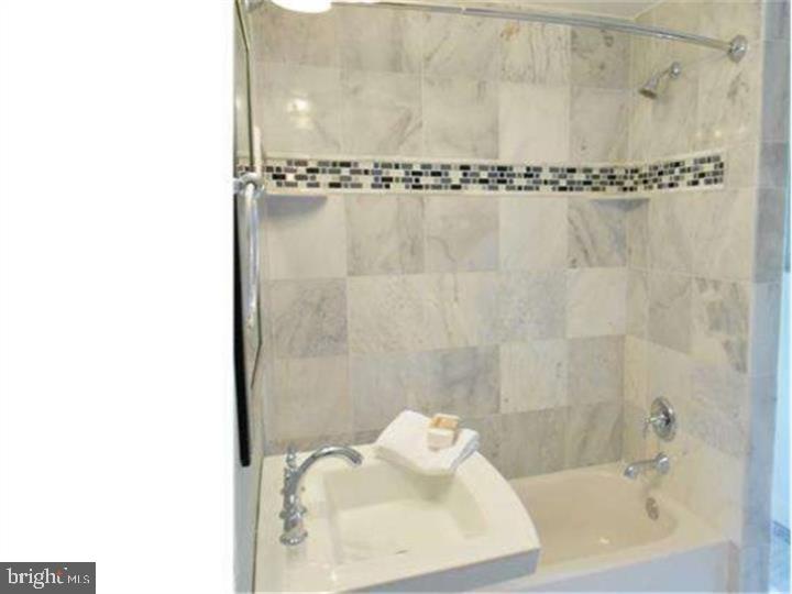 504 Conshohocken State Road Gladwyne, PA 19035 - Photo 19 of 19 a bathroom with a shower and a sink