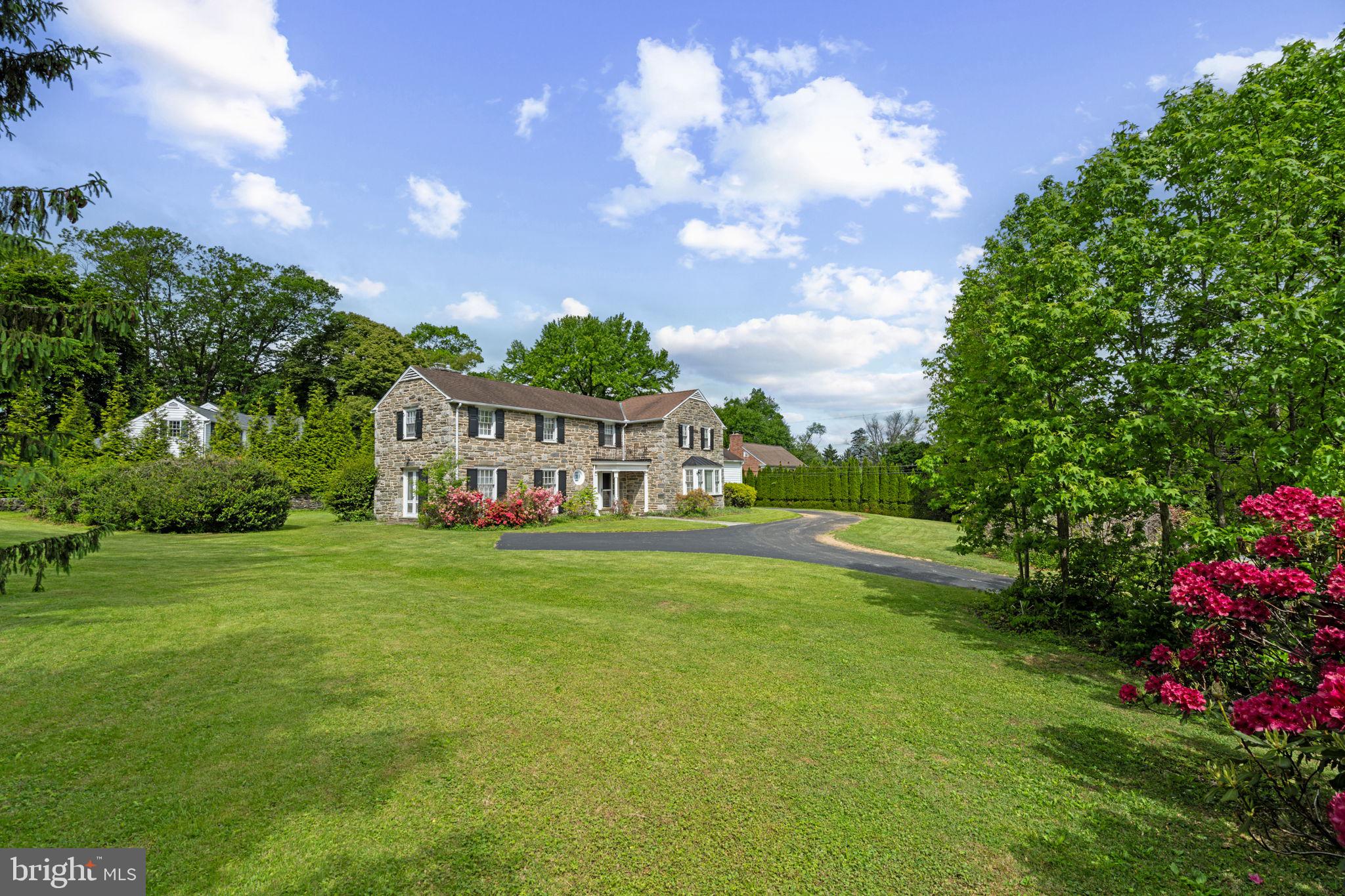 504 Conshohocken State Road Gladwyne, PA 19035 - Photo 2 of 19 a view of house with garden space and swimming pool