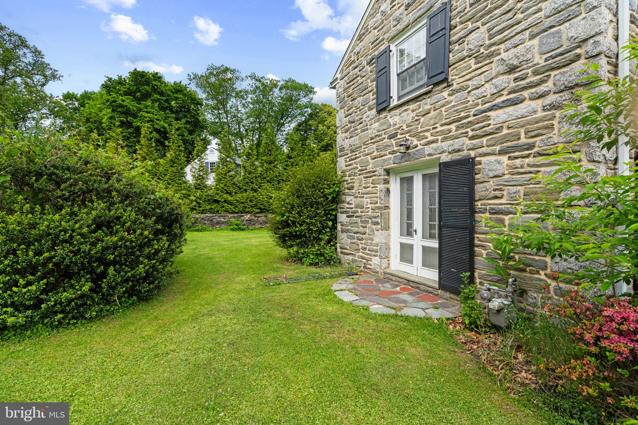 504 Conshohocken State Road Gladwyne, PA 19035 - Photo 7 of 19 a view of a backyard with plants and large tree