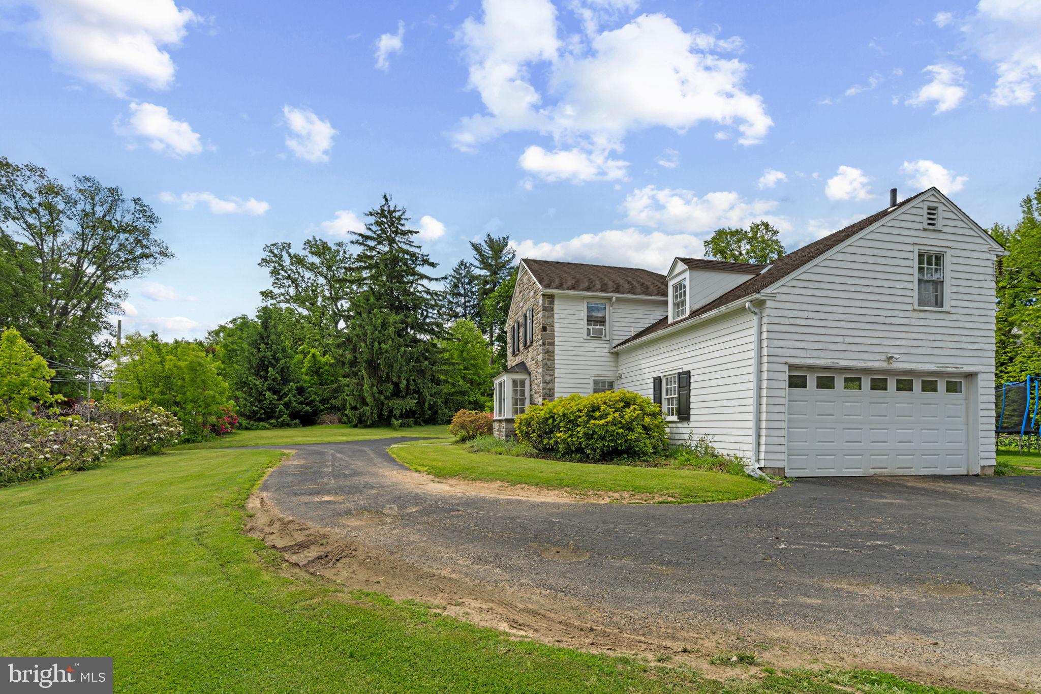 504 Conshohocken State Road Gladwyne, PA 19035 - Photo 8 of 19 a view of a house with a yard and pathway