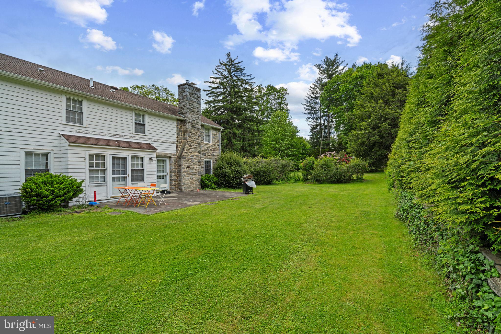 504 Conshohocken State Road Gladwyne, PA 19035 - Photo 10 of 19 a front view of a house with garden and porch