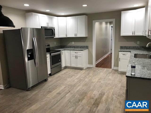 69 Dandelion Road Ruckersville, VA 22968 - Photo 2 of 10 a kitchen with stainless steel appliances granite countertop a refrigerator and a stove