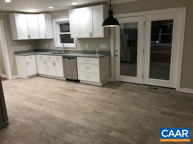 69 Dandelion Road Ruckersville, VA 22968 - Photo 3 of 10 a kitchen with stainless steel appliances granite countertop a stove a sink and a refrigerator