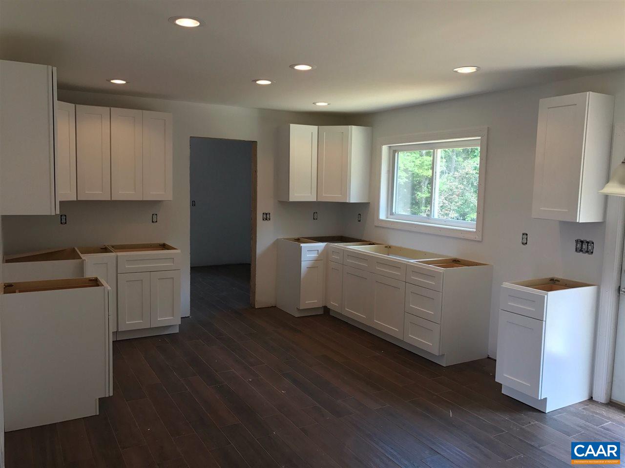 69 Dandelion Road Ruckersville, VA 22968 - Photo 7 of 10 a kitchen with a cabinets and wooden floors