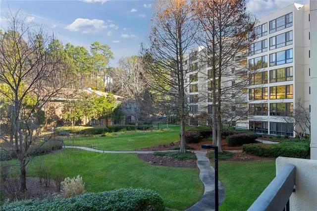 a view of a building with a yard