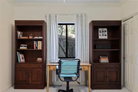 a view of hallway with cabinet and cabinet
