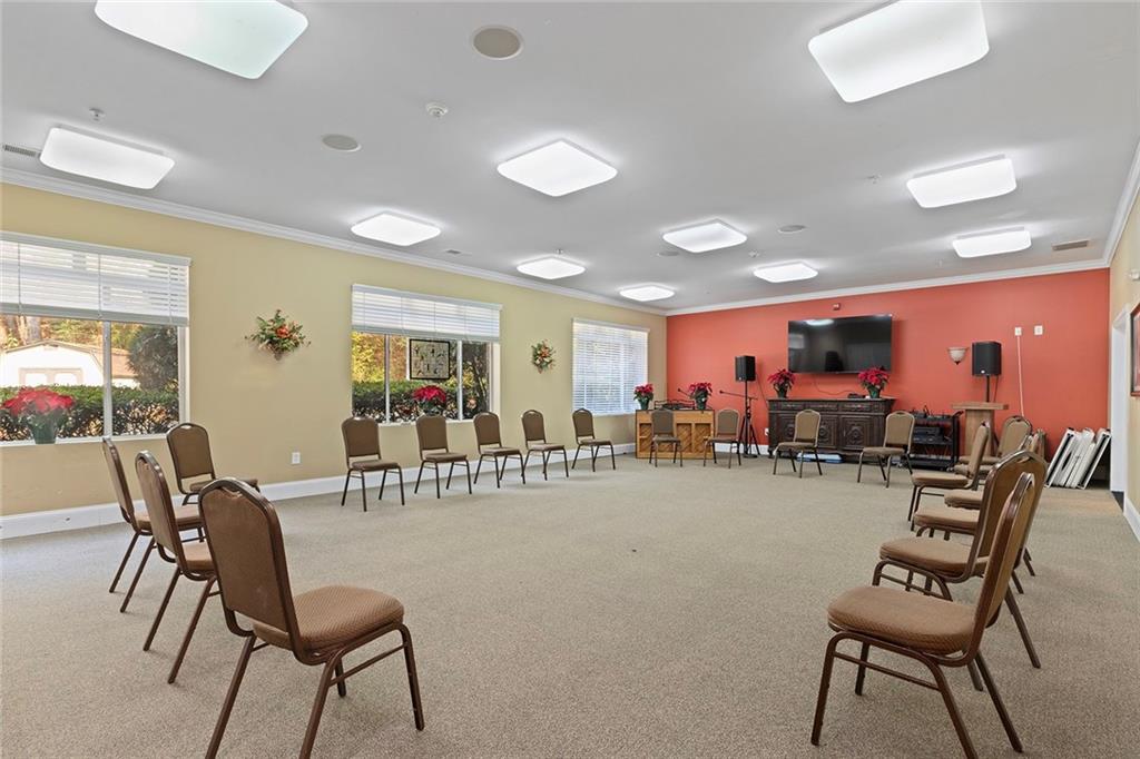 1800 Clairmont Lake, Unit A209 Decatur, GA 30033 - Photo 30 of 35 a room with lots of chairs and mirrors