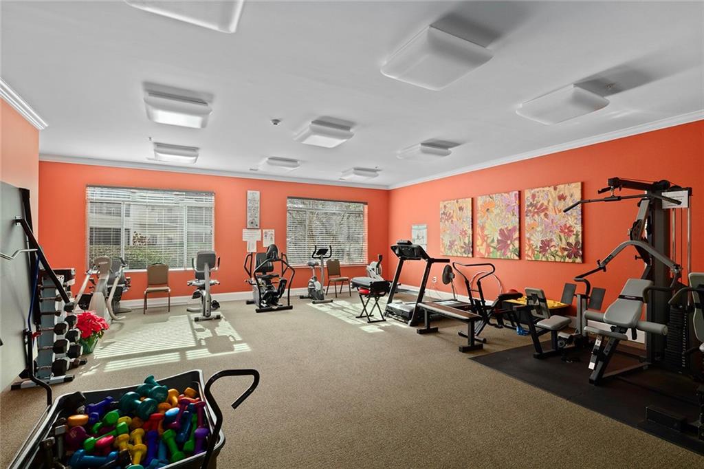 1800 Clairmont Lake, Unit A209 Decatur, GA 30033 - Photo 31 of 35 a living room with furniture a floor to ceiling window and a flat screen tv