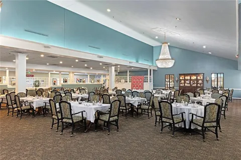a view of a dining area with furniture window and outside view