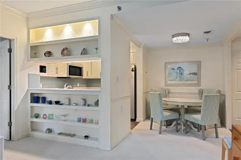 a workspace with a wooden floor and furniture