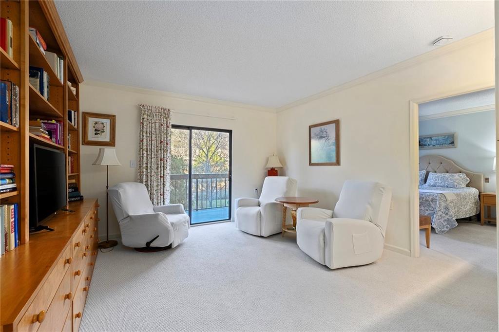1800 Clairmont Lake, Unit A209 Decatur, GA 30033 - Photo 10 of 35 a living room with furniture and a flat screen tv