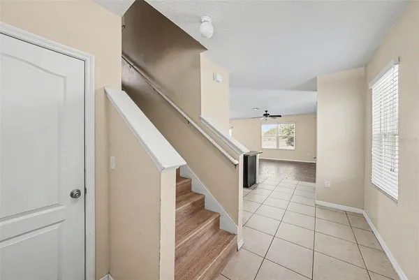 a view of entryway with stairs and wooden floor